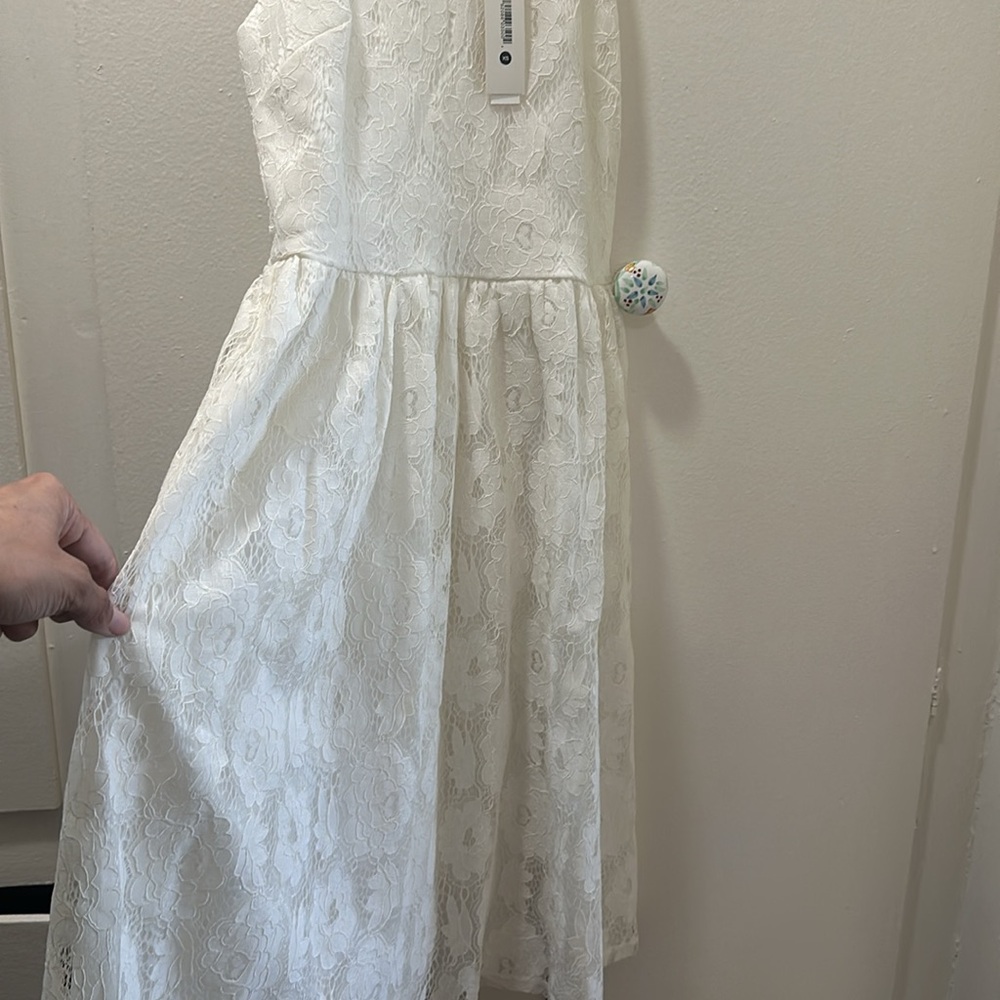 Lacy aqua dress never worn has tags from Bloomingdale’s